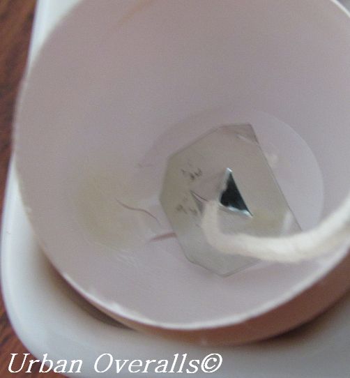 wick tab and wick positioned in eggshell